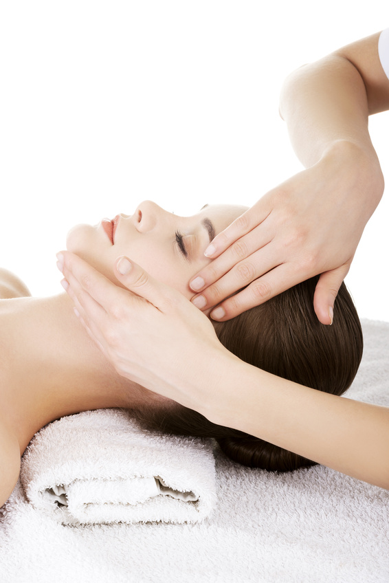 Relaxed woman enjoy receiving face massage at spa saloon